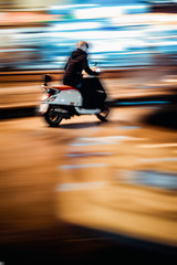  bike moving on the glittering streetmotion on the road at night