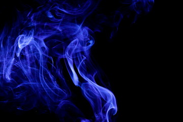 Blue smoke on black background