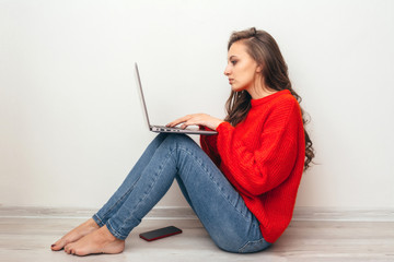 Girl with laptop at home.