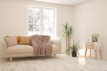 Naklejka premium Stylish room in white color with sofa and winter landscape in window. Scandinavian interior design. 3D illustration