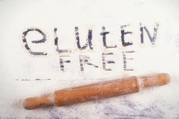 A variety of gluten-free products on a light background. Top view. Gluten free words