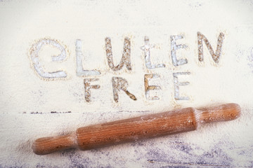 A variety of gluten-free products on a light background. Top view. Gluten free words
