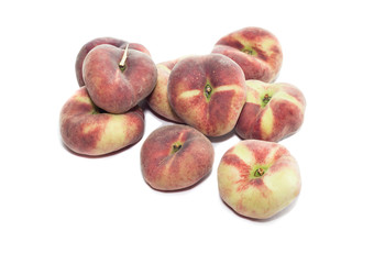A pile of peaches on a white background close-up