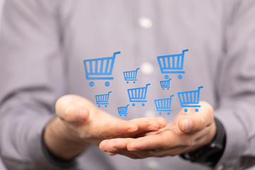 Businessman pressing modern technology panel shopping cart web phone credit card.