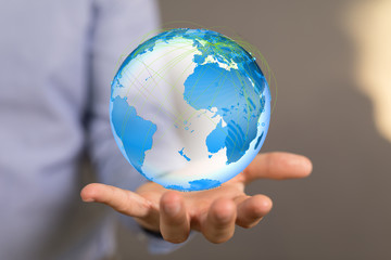 Human Hand Holding The World In Hands.