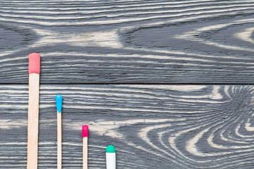 Multicolored matches on a decorative background