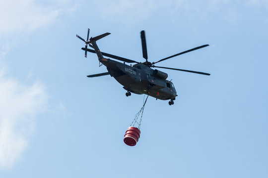 BERLIN, GERMANY - JUNE 02, 2016: Heavy-lift cargo helicopter Sikorsky CH-53 Sea Stallion of the German Army with equipment for fighting fires. Exhibition ILA Berlin Air Show 2016