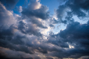 Naklejka na ściany i meble Stormy clouds on summer evening. Rainy sky before the storm.