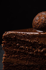 The cake is broken off with a fork on a black background