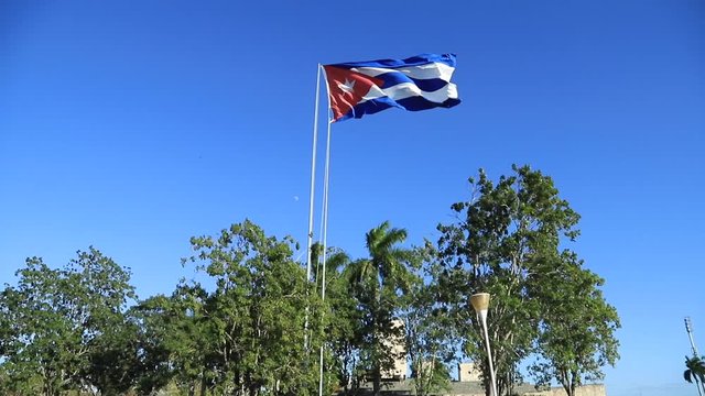 The big flag of the Republic of Cuba developing in the wind