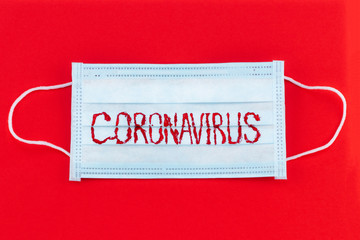 Novel coronavirus - 2019-nCoV, WUHAN virus concept. Surgical mask protective mask with CORONAVIRUS...