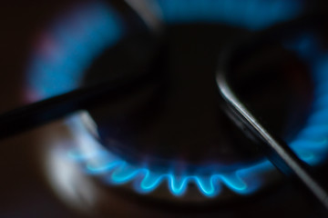 Burning blue flame of gas on the stove. Gas-burner