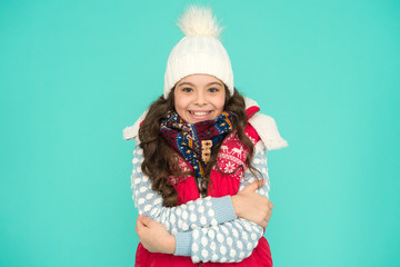 it is cold outside. Feeling warm and happy. winter vibes. Portrait of smiling girl hipster. Youth street fashion. Winter fun. feeling cold this season. Dress in layers and wear hat. Stay active