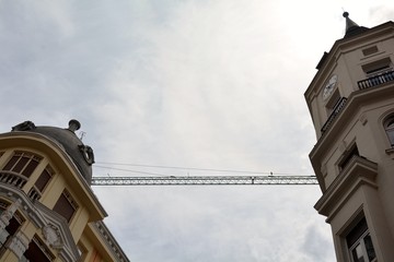 Fototapeta na wymiar two towers and a crane