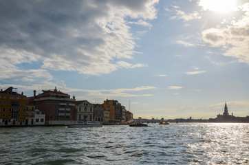 View of the lagoon of Venice and San Giorgio Maggiore. Ship traffic, morning clouds at sunrise