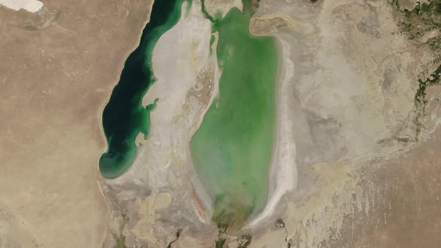 Lake water dramatic dried up time lapse, aerial satellite scenic landscape of Aral sea. Images furnished by Nasa