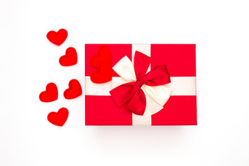 Gift or gift box, red heart on white background top view. Greeting card for Valentine's Day