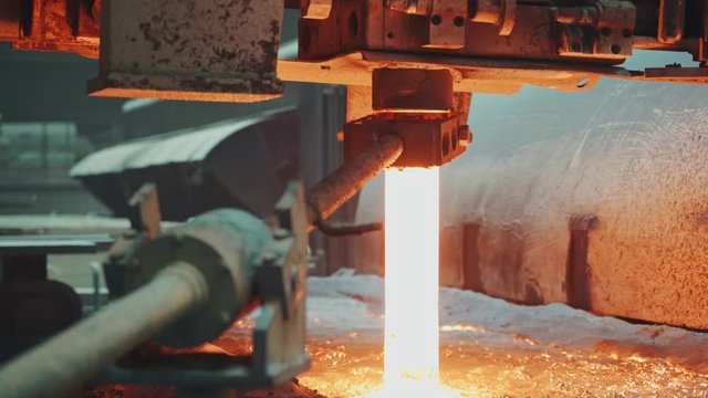 Molten metal is pouring on a steel casting foundry