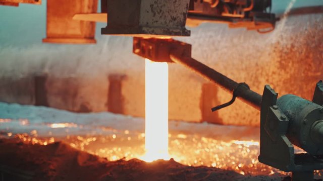 Molten metal is pouring on a steel casting foundry