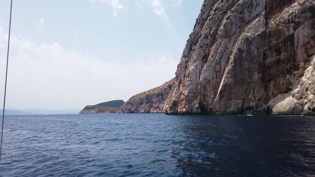 Wide shot of great waves crush to great cliff