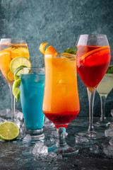 Set of alcoholic and non-alcoholic drinks. On a turquoise background. Cocktail menu. Sea mood concept.