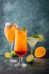 Set of alcoholic and non-alcoholic drinks. On a turquoise background. Cocktail menu. Sea mood...