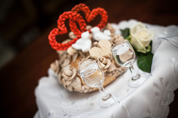 Wedding tradition in Poland and Russia. Parents welcome bride and groom with bread, vodka and salt. Decorative tray with food and alcohol. Empty copy space european culture background. 