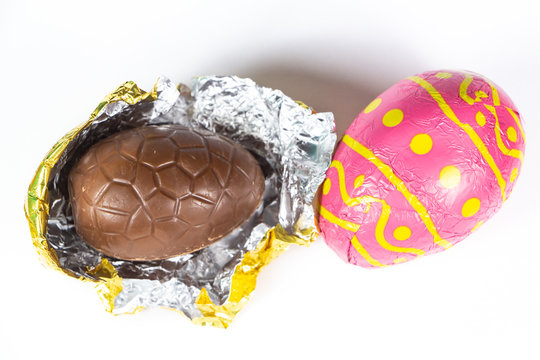 Chocolate eggs wrapped in pink paper for easter