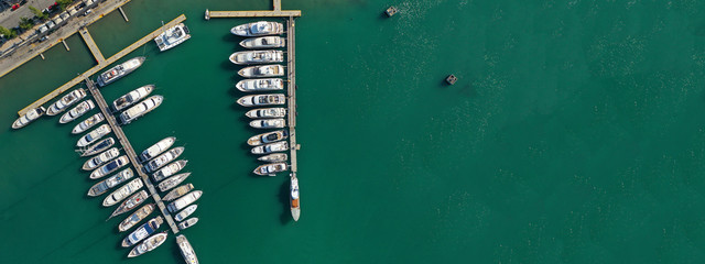 Aerial drone ultra wide top down photo of Mediterranean port with yachts docked