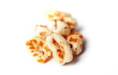 Puffed honey air rice wheat isolated on white background
