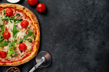 tasty italian pizza with mozzarella cheese, mushrooms, tomato, bell pepper, onion on a stone...