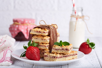 Pie bars with strawberry jam . Delicious homemade sweet dessert from shortcrust pastry. 