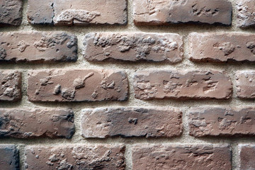 Brown brick wall, abstract background texture.