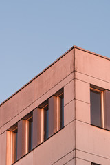 The corner of an office building in the evening light