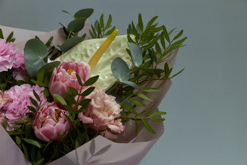 Beautiful bridal bouquet in vintage style, light gray background, selective focus