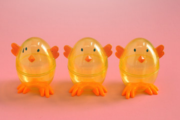 Easter chicks on the pink background. Holiday spring background.