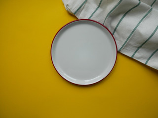 white dish on yellow background