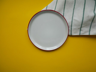 white dish on yellow background