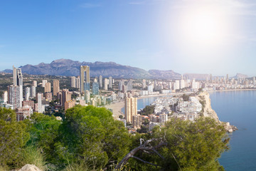Fototapeta na wymiar Breathtaking view of the coastline in Benidorm with high buildings, mountains and sea