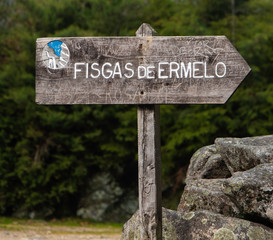 Wood road sign indicating Fisgas de Ermelo direction, in Mondim de Basto, Vila Real, Portugal