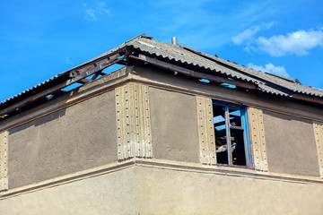 abandoned house with broken roof