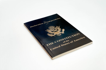 high angle view of booklet with declaration of independence and constitution of united states of america on white background