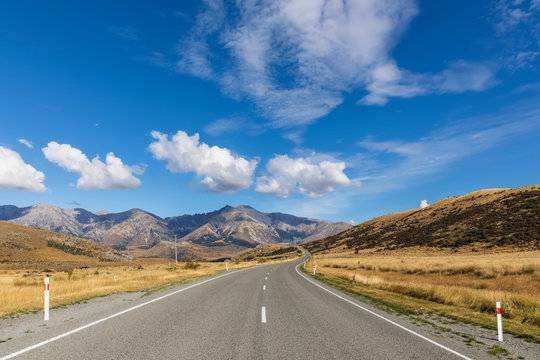 New Zealand, Clouds Over Empty State Highway 73 With Mountains In Background