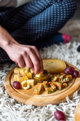 Cheese plate served with nuts, Top view. Assorted cheeses Camembert, Brie, Parmesan blue cheese, goat.