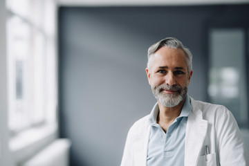 Portrait of smiling mature doctor