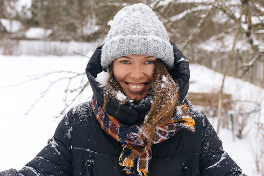 Portrait of woman enjoying snowfall