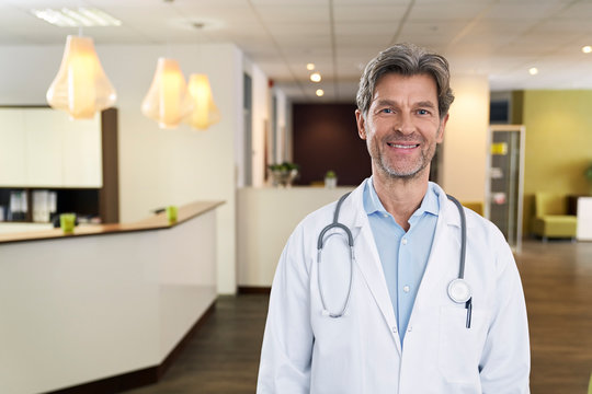 Portrait of confident doctor in his medical practice