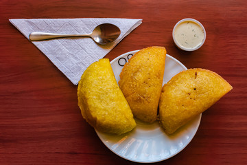 typical Colombian empanadas, served with chili pepper and tartara sauce, Bogotá Colombia, February...