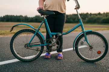 Picture of a chubby girl rides a bike in village