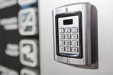 Metal intercom electronic access control door box with numeric keypad.